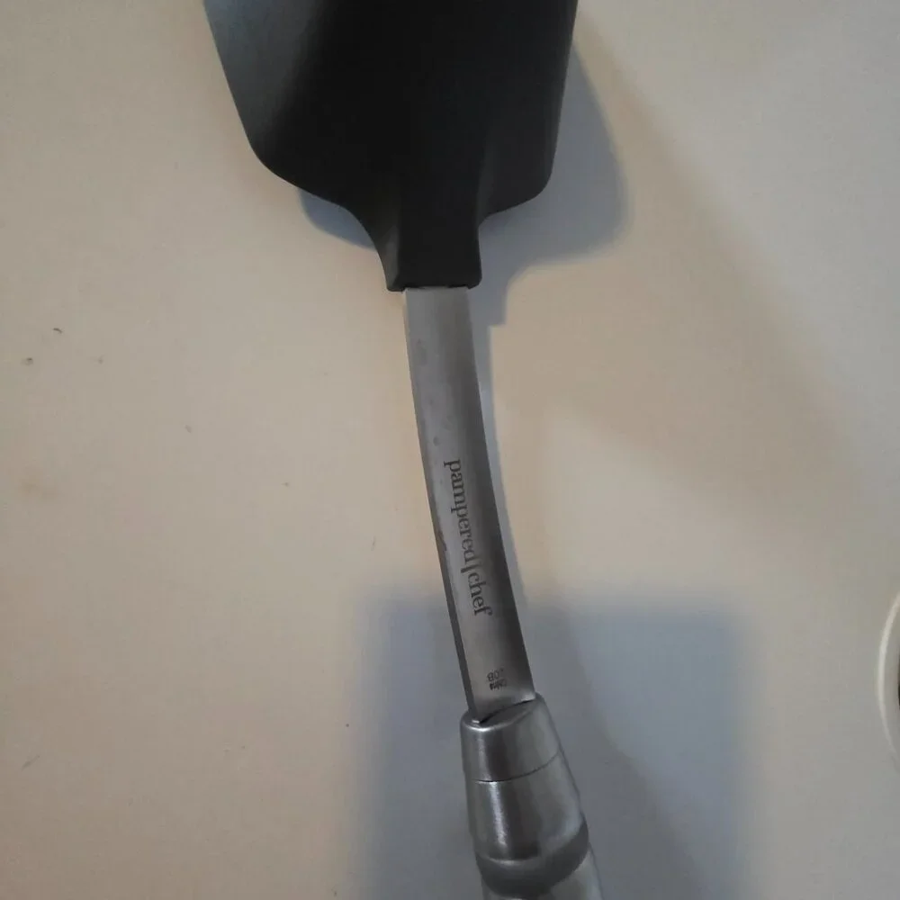 The item in your image is the Pampered Chef Scoop & Serve Spatula (Item #100286)